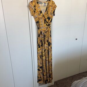Olivia Matthews Elegant Black and Gold Maxi Dress